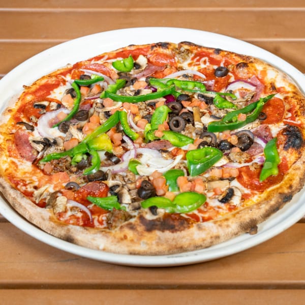 Cali-Forno Pizzeria's supreme pizza, topped with pepperoni, sausage, olives, onions, mushrooms, and peppers.